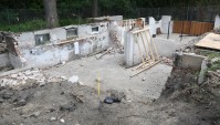 This is the foundation of the Frank Lloyd Wright - designed Sherman Booth Cottage (1913) which was moved to its new home in a park about one tenth of a mile away in suburban Glencoe, Illinois Tuesday July 21, 2020. The cottage was threatened with demolition by the new owners of the lot it has stood on since 1916. With the help of the Frank Lloyd Wright Building Conservancy, the nonprofit Glencoe Historical Society acquired the home and hopes to remodel it and turn it into a museum and research center. The diminutive home, built for Wright’s attorney Sherman Booth while his larger Wright home was being built nearby, is said by some Wright aficionados to be a precursor to his post-1936 Usonian home designs. There are five other Wright homes in the nearby Ravine Bluffs neighborhood.